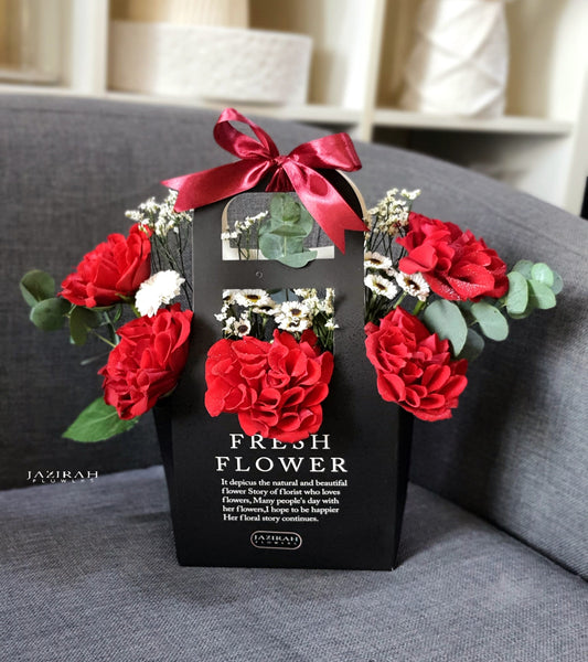 Red Roses Flower Bag with White Desi Flowers – Handcrafted Fresh Arrangement