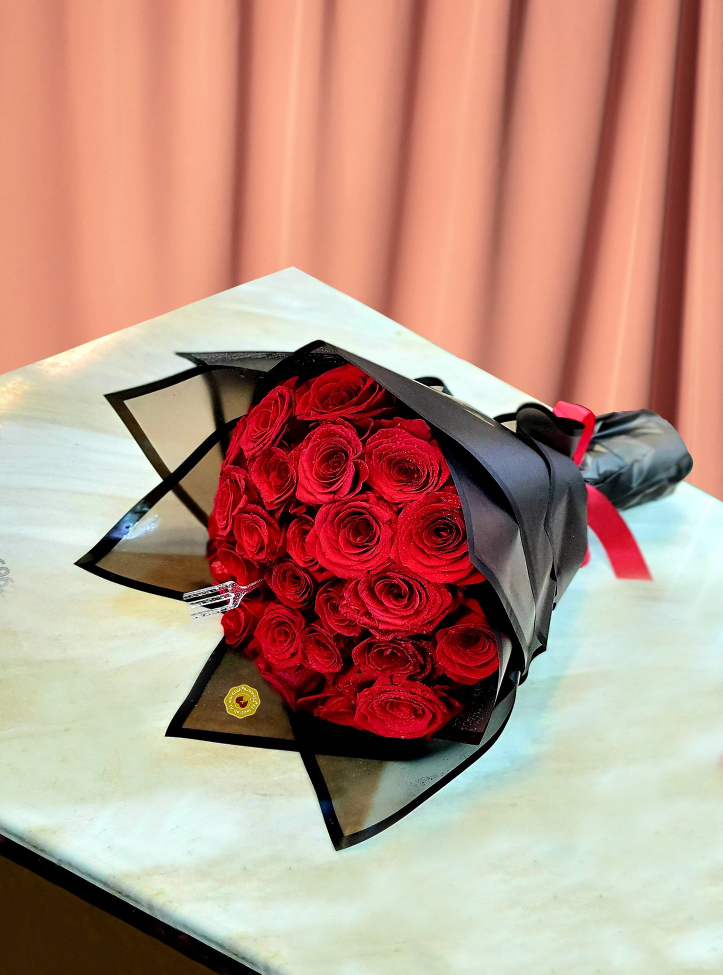 Red roses bouquet black wrapping