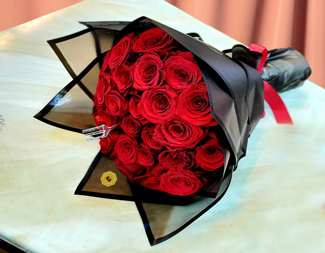Red roses bouquet black wrapping