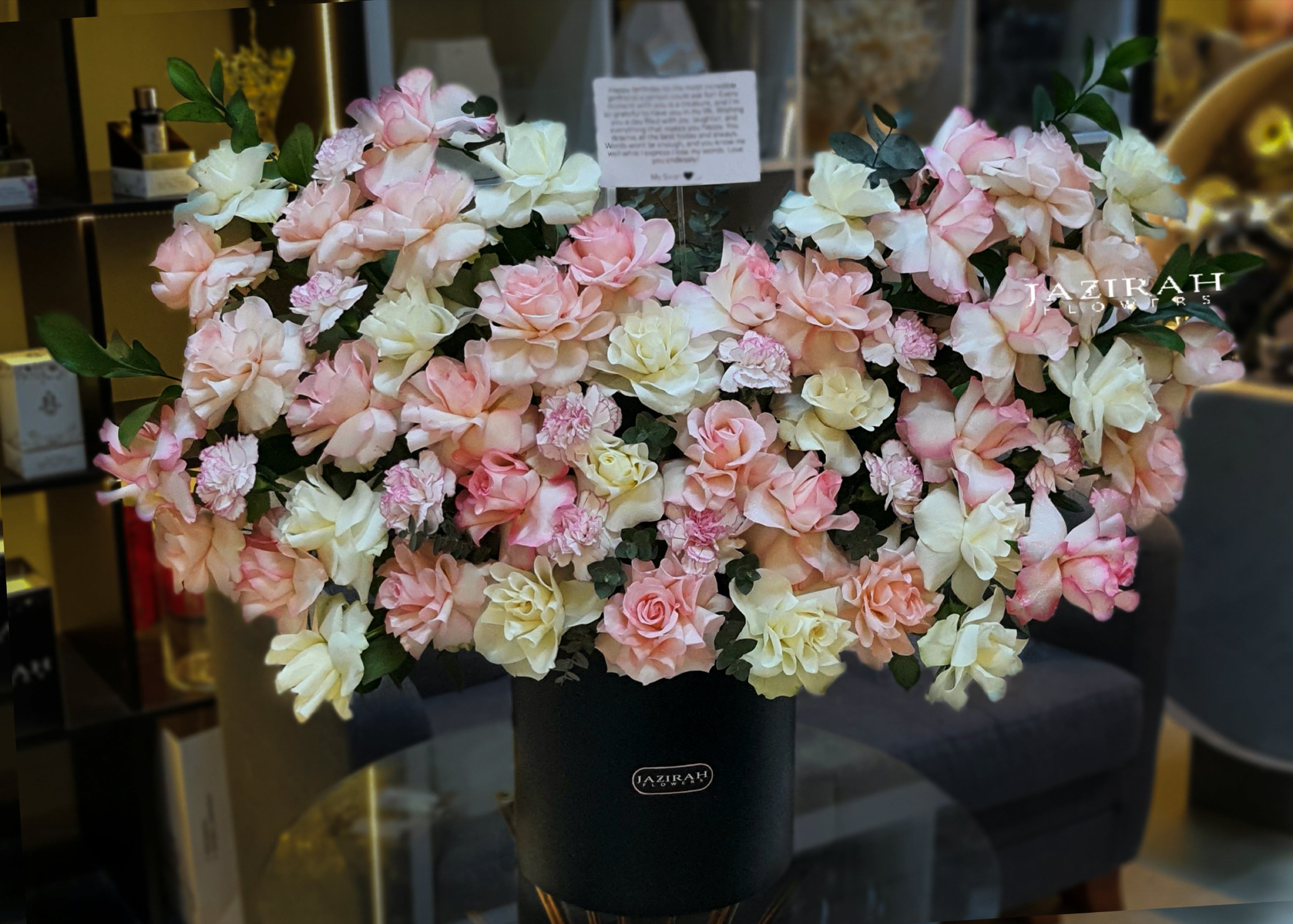 Blush and cream rose bouquet in luxury black box by Jazirah Flowers – romantic flower arrangement