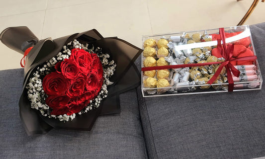 Red roses bouquet, black wrapping, with chocolate box