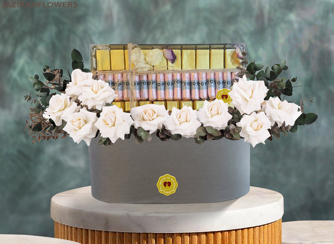 flowers with chocolate in a box, white roes. Flower combo