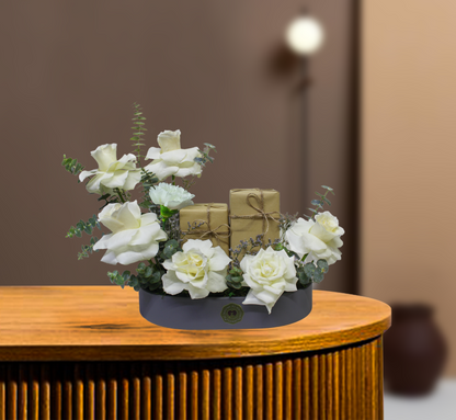 Flowers arrangement in a tray with perfume  