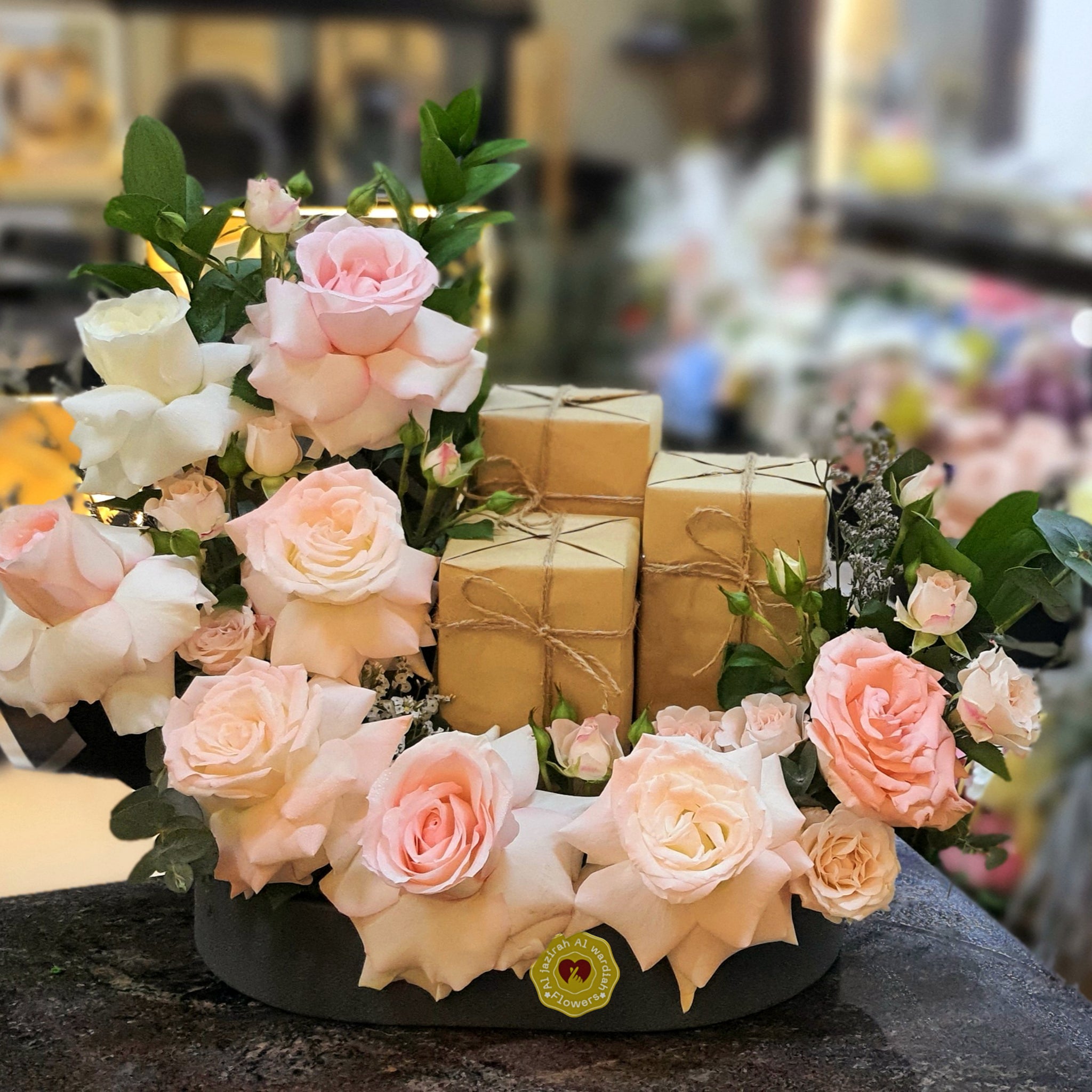 luxury perfume and fresh flower arrangement in a tray