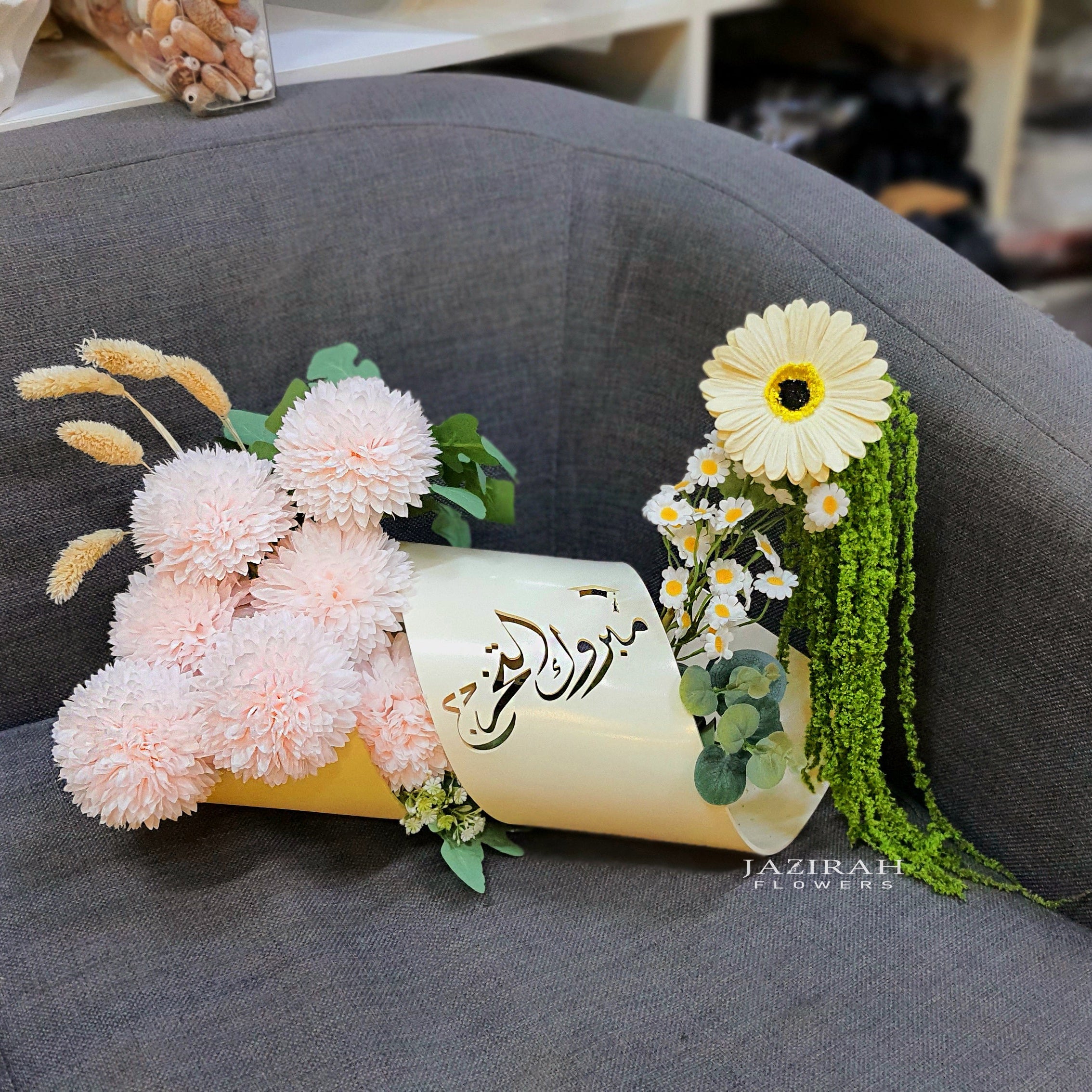 Graduation acrylic stand with elegant Artificial flower arrangement
