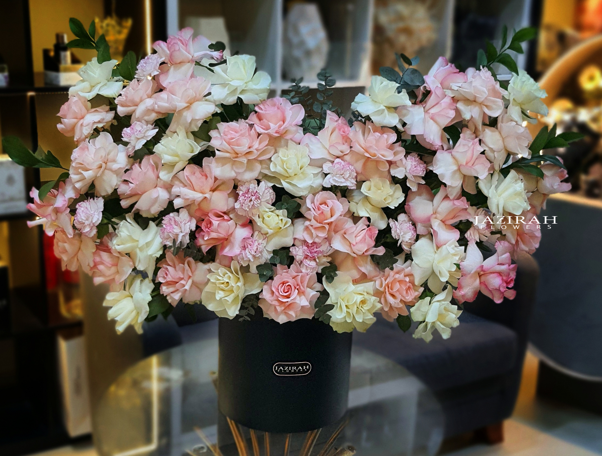 Blush and cream rose bouquet in luxury black box by Jazirah Flowers – romantic flower arrangement