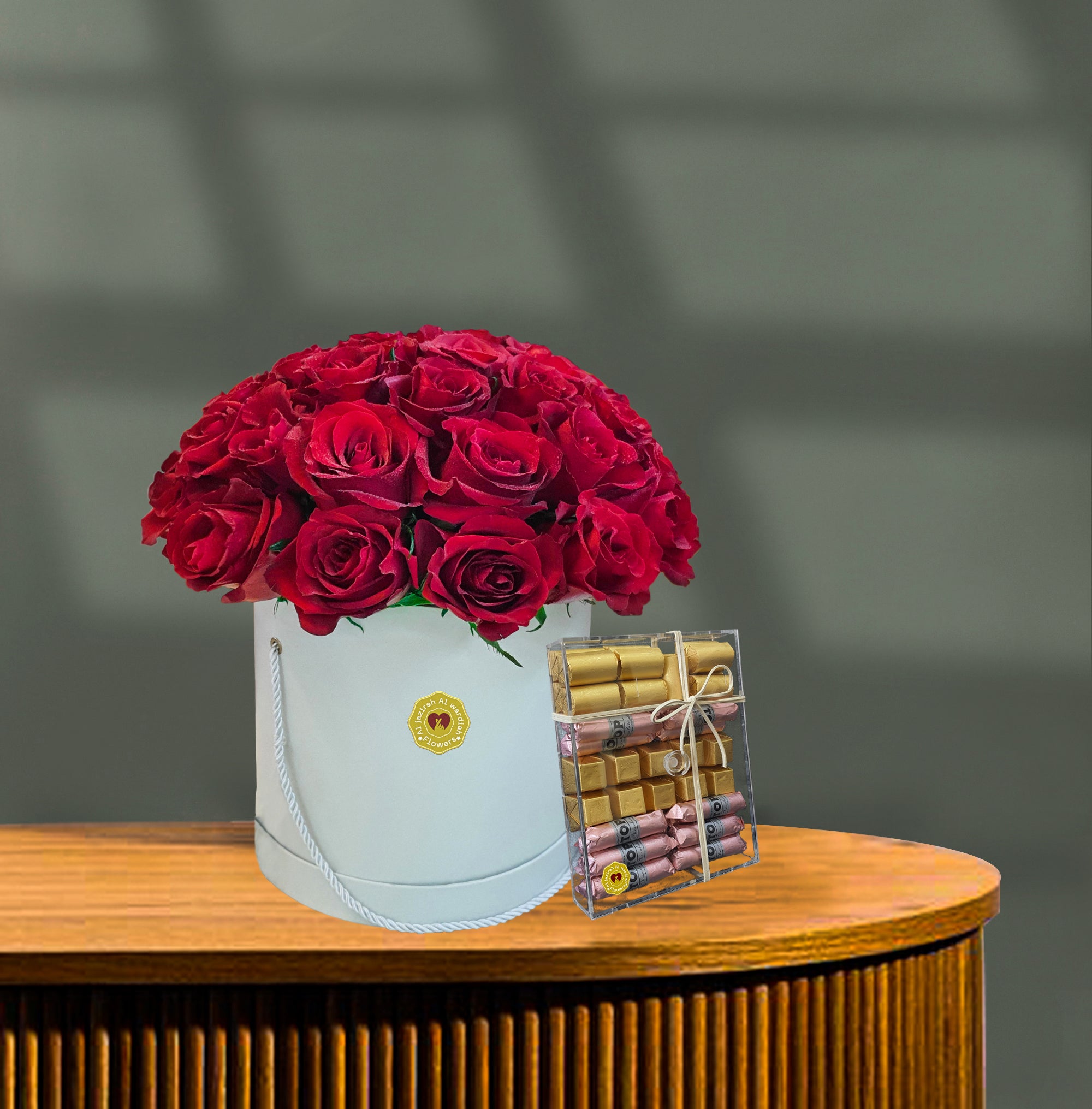 Red roses round box bouquet with chocolate