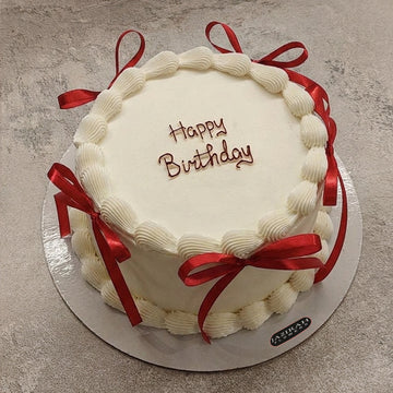 Classic Vanilla Birthday Cake with Red Satin Ribbons – Elegant Celebration Cake