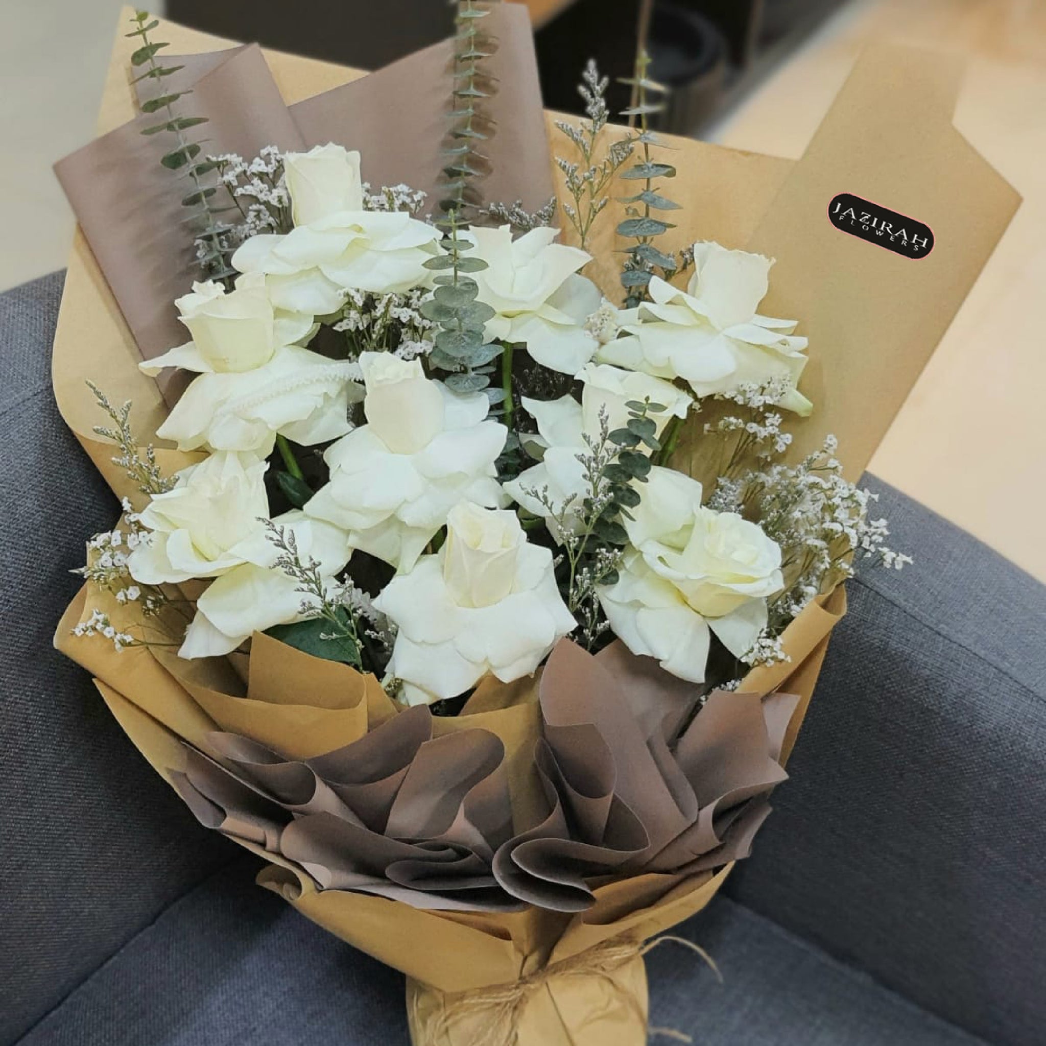 Elegant White Rose Bouquet – Fresh White Roses with Eucalyptus & Rustic Wrapping