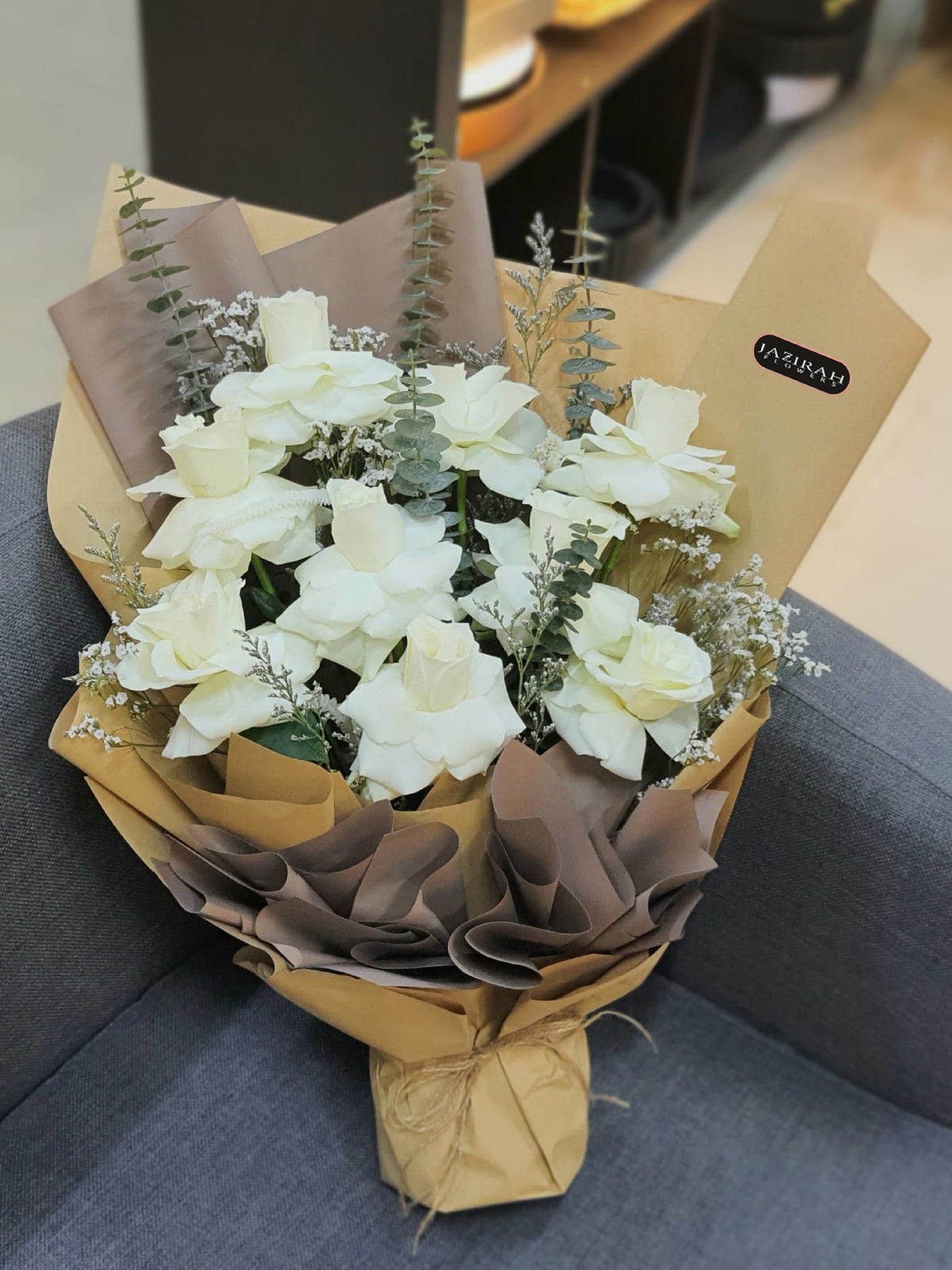 Elegant White Rose Bouquet – Fresh White Roses with Eucalyptus & Rustic Wrapping