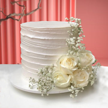 Elegant White Floral Cake with Fresh Roses – Luxury Celebration Cake UAE