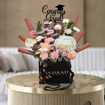 Graduation Flower Arrangement in Luxury Bag – Mixed Fresh Blooms with "Congrats Grad" Topper | Jazirah Flowers