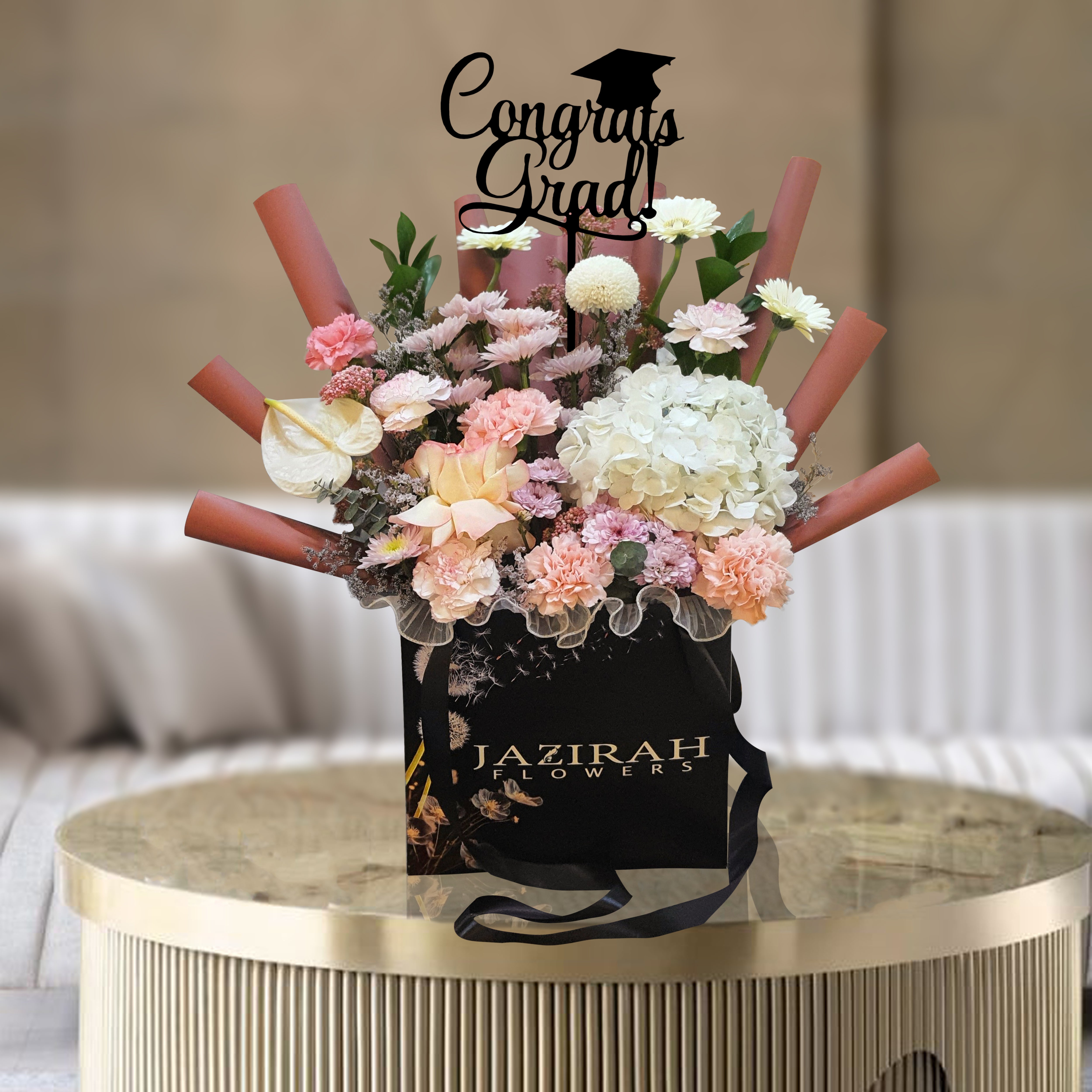 Graduation Flower Arrangement in Luxury Bag – Mixed Fresh Blooms with "Congrats Grad" Topper | Jazirah Flowers