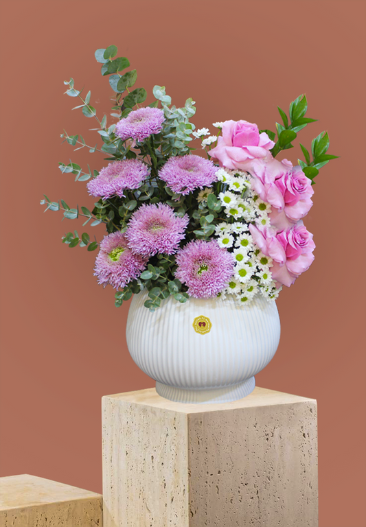 Flower bouquet arrangement with a vase