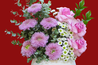 Flower bouquet arrangement with a vase