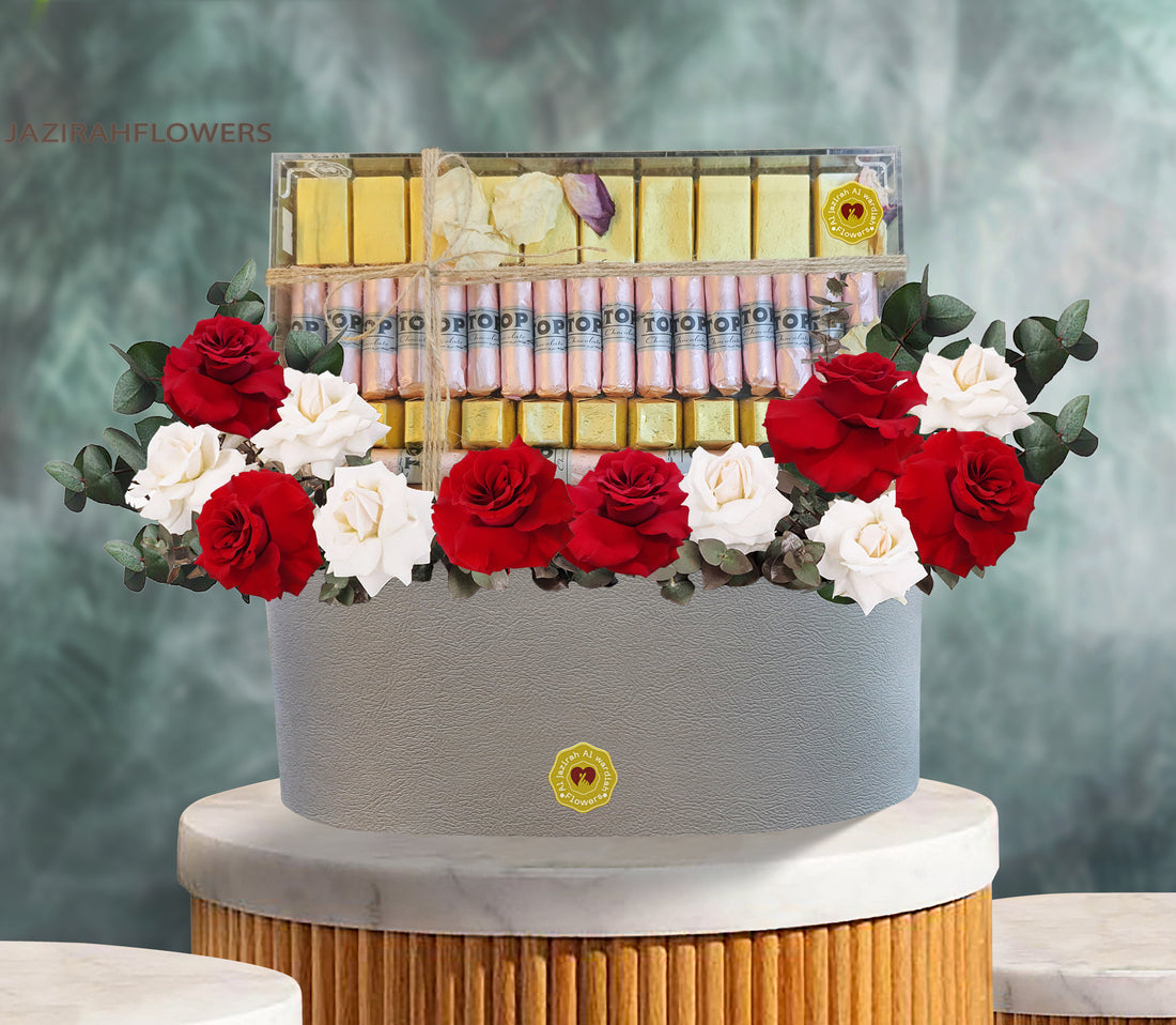 Flowers with chocolate in a tray, fresh flowers red and white