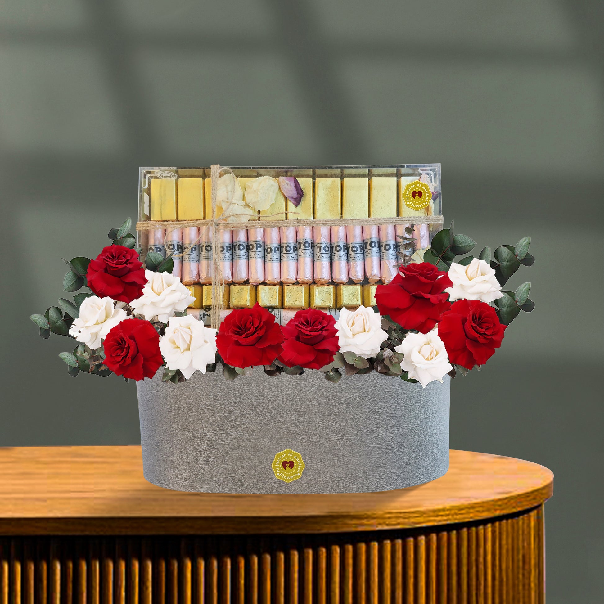 Flowers with chocolate in a tray, fresh flowers red and white