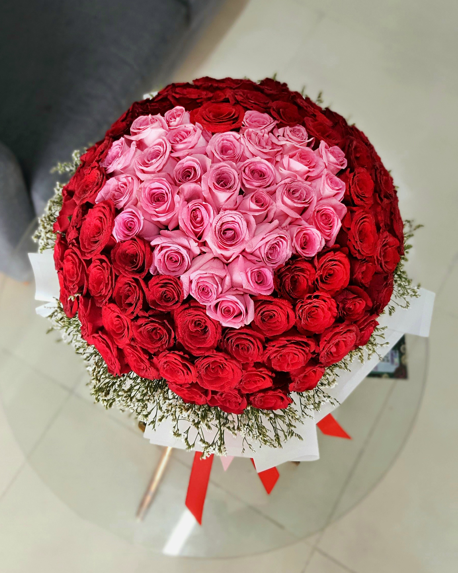 Red And pink Roses Bouquet Inside a Heart of Pink Roses